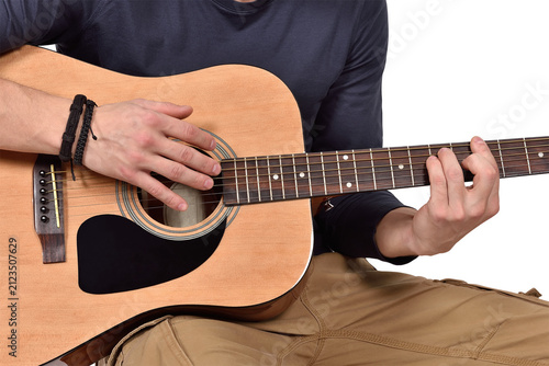 Man playing acoustic guitar.