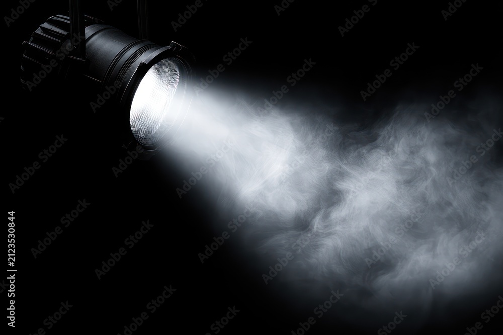 Naklejka premium Stage light beam in smoky dark atmosphere