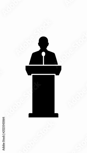 Speaker Standing at Podium Delivering Presentation in Minimalist Studio