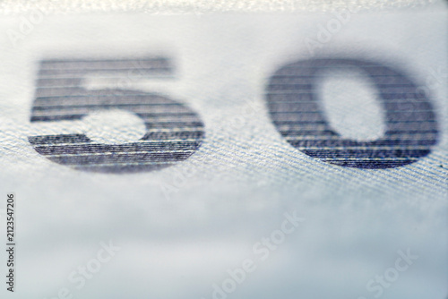 Close-up Macro Shot of Number 50 Printed on Paper Texture Surface