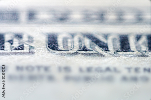 Extreme close-up view of detailed vintage currency text with partial blur