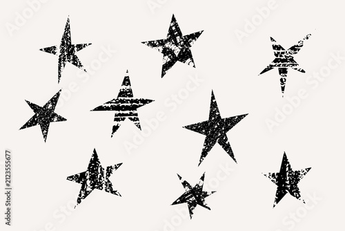 Distressed black stars create grunge texture set with nine rough vintage shapes