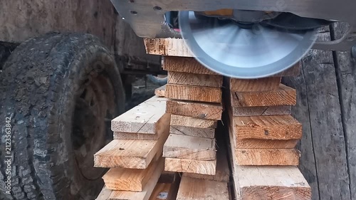 Cordless Circular Saw Cutting Wood Planks with Blade Acceleration Whine and Timber Sawing Groans -- Close-up on Saw Blade During Multiple Cuts