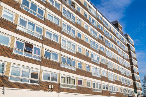 Council apartment block facade with repeating windows on the York Way Estate in Islington, London, UK