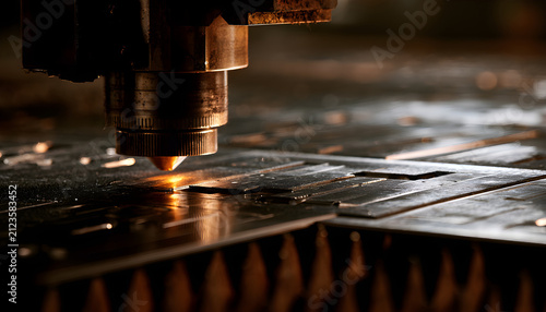 Medium shot showcasing stainless steel sheets being laser cut into smooth corrosion-resistant handtool blanks emphasizing clean edges and reflective metal surfaces.