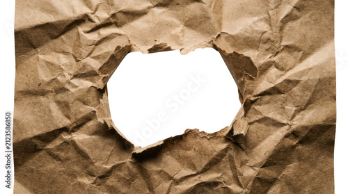 Crumpled brown craft paper with a torn hole in the center isolated on transparent background