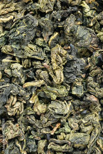 Macro dried tea leaf surface fullframe Tie Guan Yin background