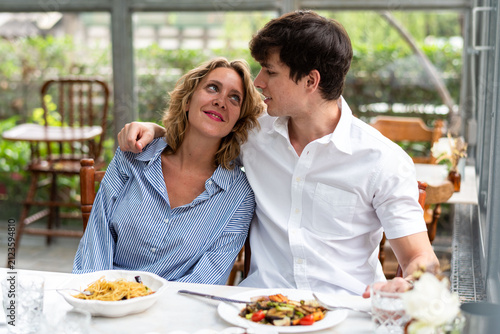 Фотография Couple enjoying romantic lunch together.