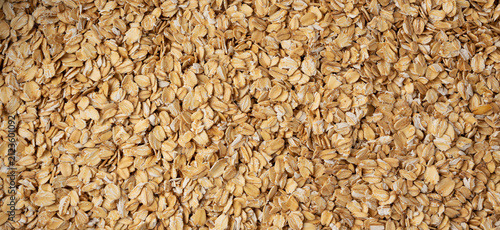 Plakat Oat flakes textured pattern, rolled oatmeal macro background