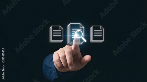 A business person touching a digital holographic screen to search for important electronic documents and files in a virtual office