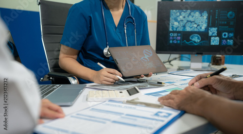 Medical team working on digital tablet healthcare doctor technology tablet using computer analyzed the results of medical reports.