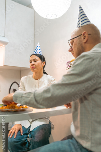 Photography Couple Birthday Dinner Kitchen: Man woman celebrating birthday eating dinner together in kitchen