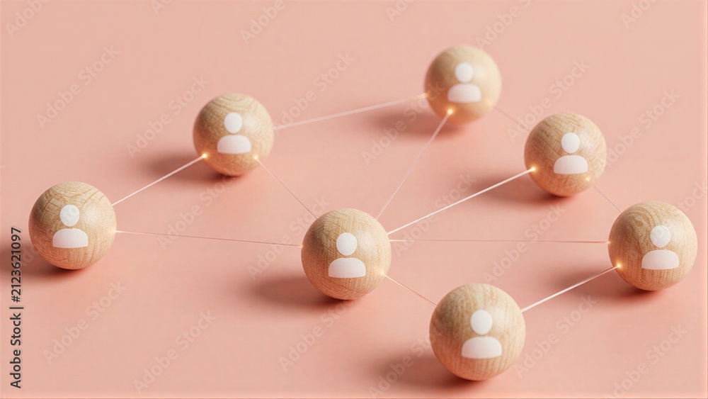 Obraz premium Wooden spheres with person icons connect by glowing lines, symbolizing networked relationships.