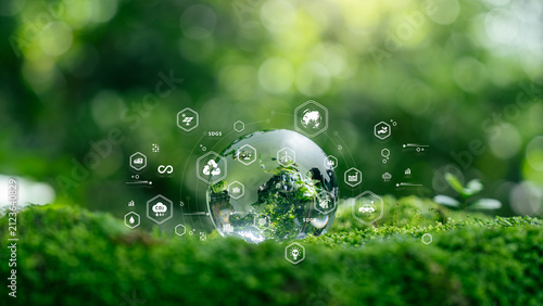 Renewable energy and energy transition concept. glass globe with sustainability icons, climate action, net zero, carbon reduction, ESG, clean energy, circular economy and environmental responsibility