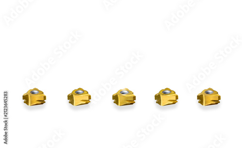 Gold carbide indexable threading inserts isolated on white background. Precision CNC metalworking turning cutting tools with 3 teeth for lathe machining.
