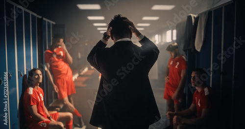 Cuadro en lienzo Frustrated Soccer Coach in Suit Holds Head With Both Hands in Disbelief While Up
