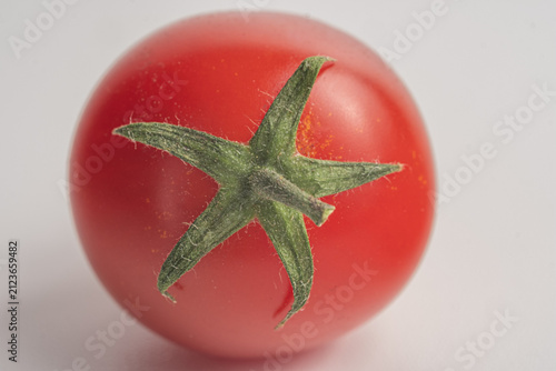red tomato on a white background