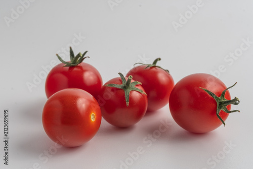 red tomatoes on a vine