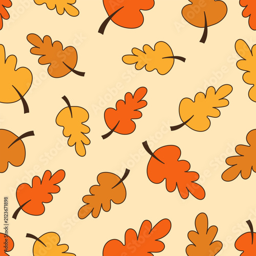 Seamless pattern with autumn oak leaves in warm colors