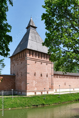 Red brick Kopytenskaya Tower of Smolensk Fortress Wall on sunny summer day, Russia
