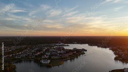 Aerial view of large mansion houses with swimming pool, in affluent neighborhood by Woodlands lake, Houston, Texas, expensive suburban houses by sunset, USA