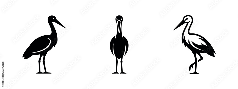 Obraz premium Silhouettes of three storks or wading birds, two standing, one in profile