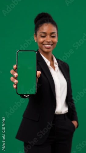 African American Woman Holding Smartphone with Green Screen Display Toward Camera, Mobile App Mockup, Digital Presentation, Blank Screen, Business Technology, Isolated Background
