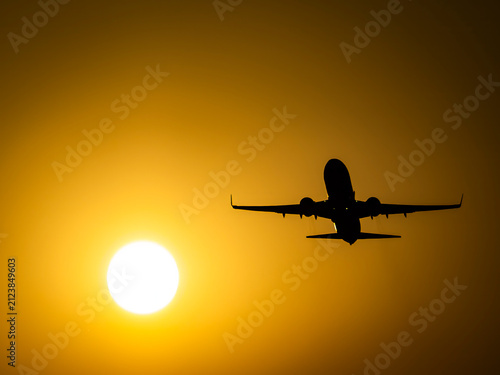 Photograph of commercial airplanes photographed at sunset
