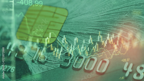Business chart showing stock exchange trading alongside a credit card graphic in a digital workspace setting