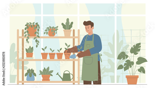 Young handsome man in a green apron caring for potted plants on wooden shelves inside a bright home nursery room.