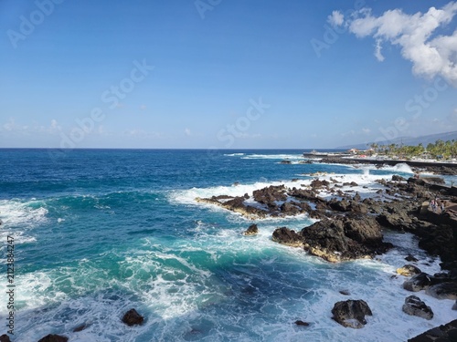 Ocean waves crashing on rocky coastline