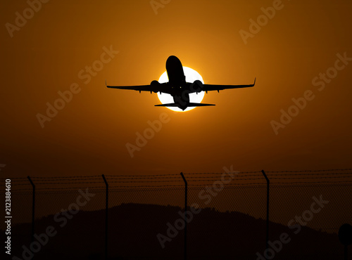 Photograph of commercial airplanes photographed at sunset