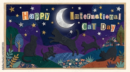 International Cat Day paper cutout greeting with black cat silhouettes leaping under a silver crescent moon and starry sky, whimsical layered paper art landscape celebration.
