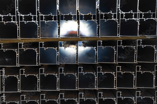 Stacked thermal break aluminum alloy window profiles stored in factory workshop