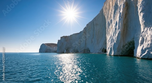 Majestic white cliffs meeting a vibrant turquoise sea under a brilliant sun