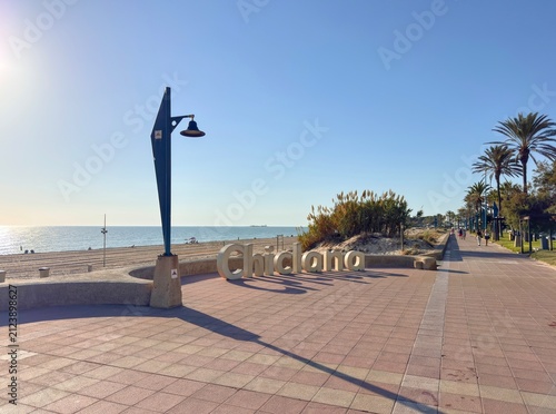 sunset on the beach promenade of la Barossa with CHICLANA lettering, Playa de la Barrosa, Playa Sancti Petri, Costa de la Luz, Andalusia, Spain
