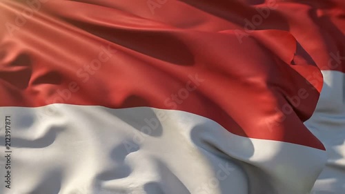 Indonesian Flag Waving in the Wind Against a Clear Blue Sky