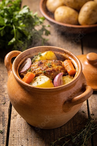 Slow Cooked Rustic Pot Roast with Vegetables in Traditional Clay Pot