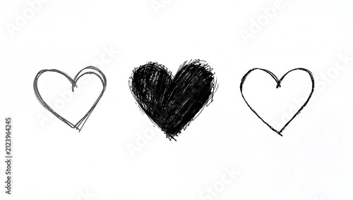 Three hand-drawn hearts in black and white, one solid and two outlines
