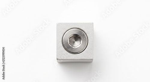 Macro photograph of an SLA 3D printer build plate leveling hex screw against a sandblasted aluminum block.