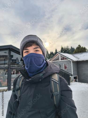 Portrait of a teenager in winter clothing at a ski resort