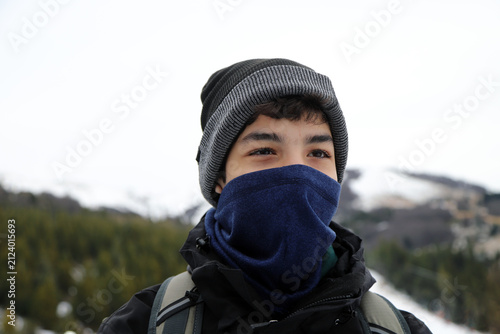 Portrait of a teenager in winter clothing at a ski resort