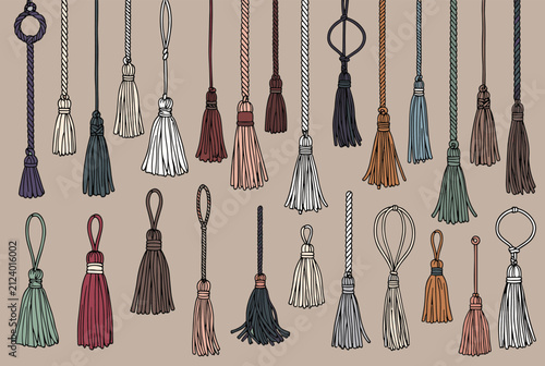 Wide variety of hand drawn decorative tassels in different colors and styles hanging against a neutral background.