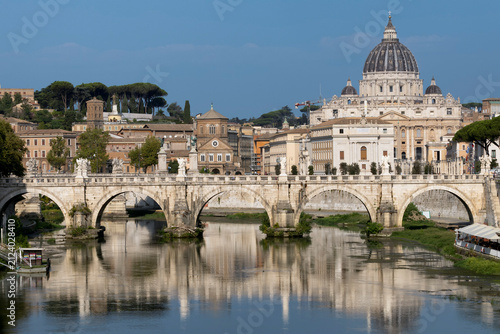 Photography St. Peter's cathedral over bridge and river in Rome, Italy