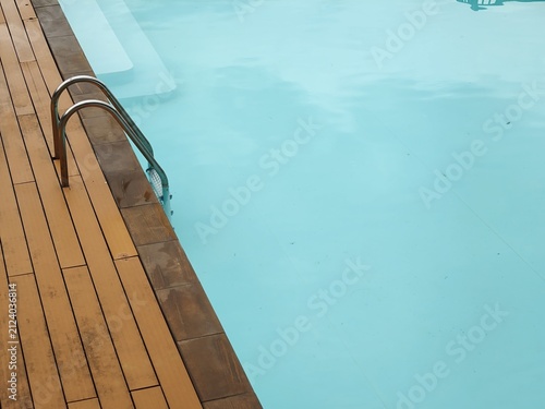 Poolside Ladder and Steps in Turquoise Water