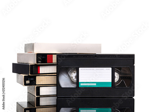 Stack of vintage VHS cassette tapes isolated on white back