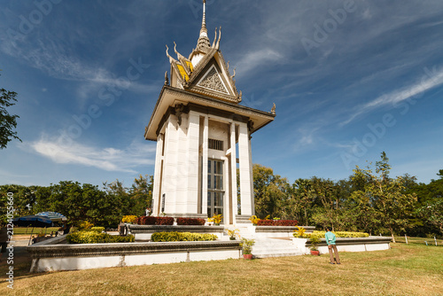 Canvas Print A man stands in front of the Killing Fields Memorial Stupa in Phnom Penh, Cambod