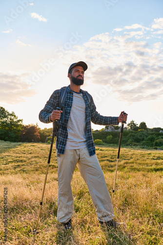 Obraz na plátne Handsome african american hiker enjoying freedom on a mountain trail