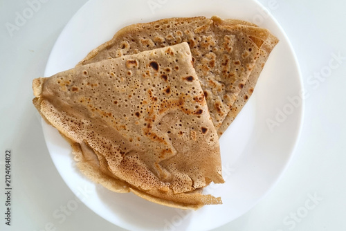 Delicious Homemade Crepes on White Plate for Breakfast or Dessert
