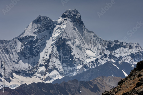 Obraz na płótnie Jirishanca's razor-sharp granite and ice spires pierce a flawless Andean sky in Peru's remote Cordillera Huayhuash, one of the most dramatic and least-visited mountain ranges on Earth